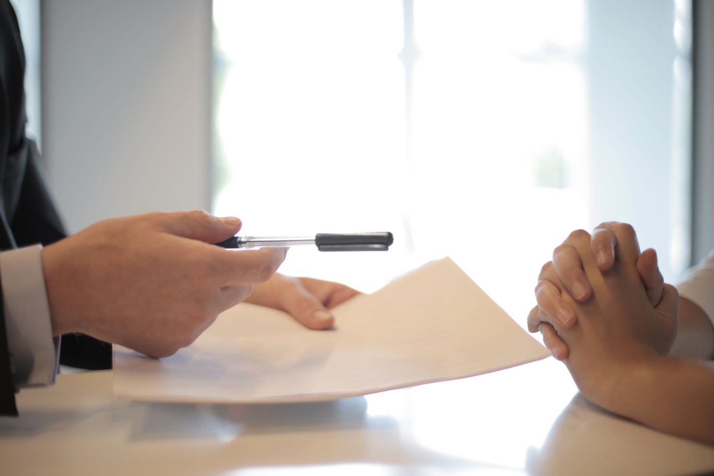 A specialist going over paperwork with a client